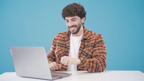 Handsome-Young-Man-With-Curly-Hair-Using-Laptop.